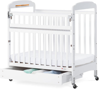 Foundations Serenity Safereach Crib with Adjustable Mattress Board, Compact Wooden Baby Crib with Commercial Grade Casters, Clear End Panels for Child Visibility, Includes 3” Foam Mattress (White) Baby Products Cribs Furniture Infant & Toddler Beds Nursery