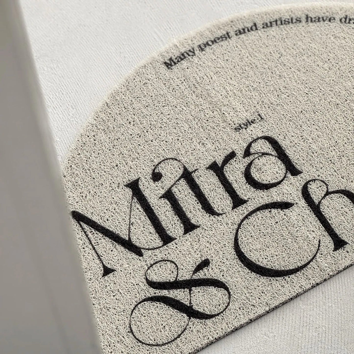 Textured Minimalist Typography PVC Coil Accent Rug