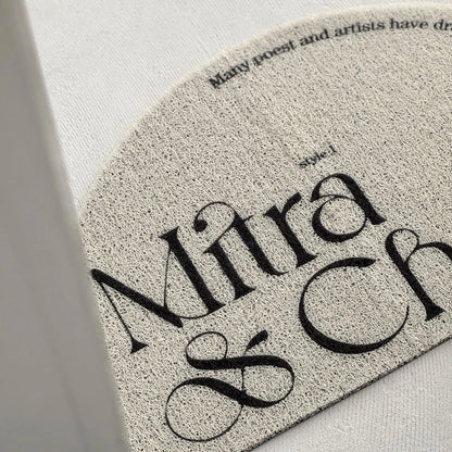 Textured Minimalist Typography PVC Coil Accent Rug