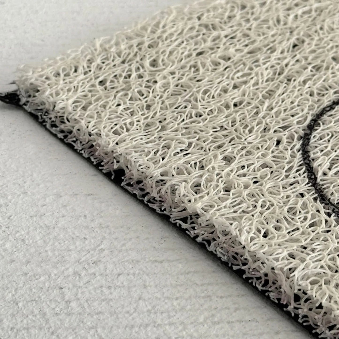 Textured Minimalist Typography PVC Coil Accent Rug