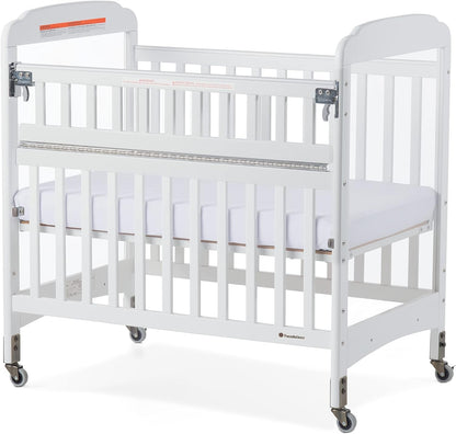 Foundations Serenity Safereach Crib with Adjustable Mattress Board, Compact Wooden Baby Crib with Commercial Grade Casters, Clear End Panels for Child Visibility, Includes 3” Foam Mattress (White) Baby Products Cribs Furniture Infant & Toddler Beds Nursery