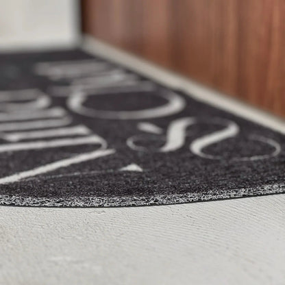 Textured Minimalist Typography PVC Coil Accent Rug