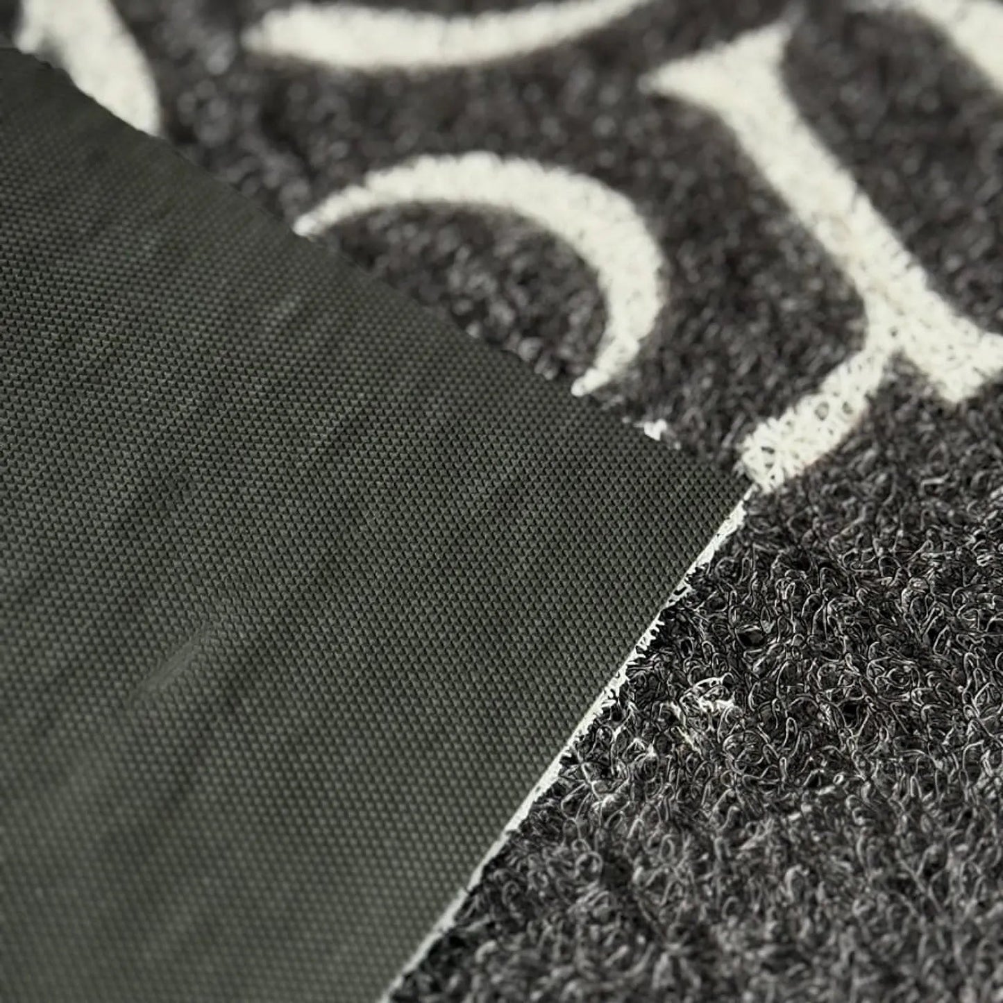 Textured Minimalist Typography PVC Coil Accent Rug