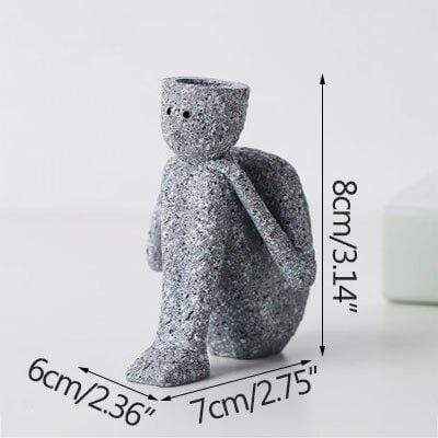 Vase de figurines miniatures de personnages abstraits