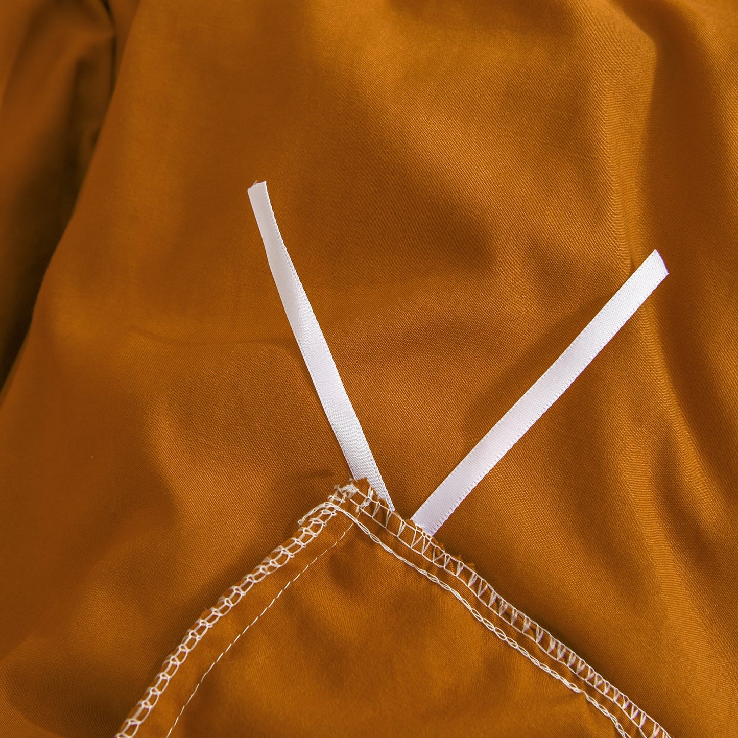 Ensemble de housse de couette à pompons orange brûlé