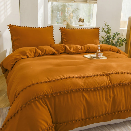 Ensemble de housse de couette à pompons orange brûlé