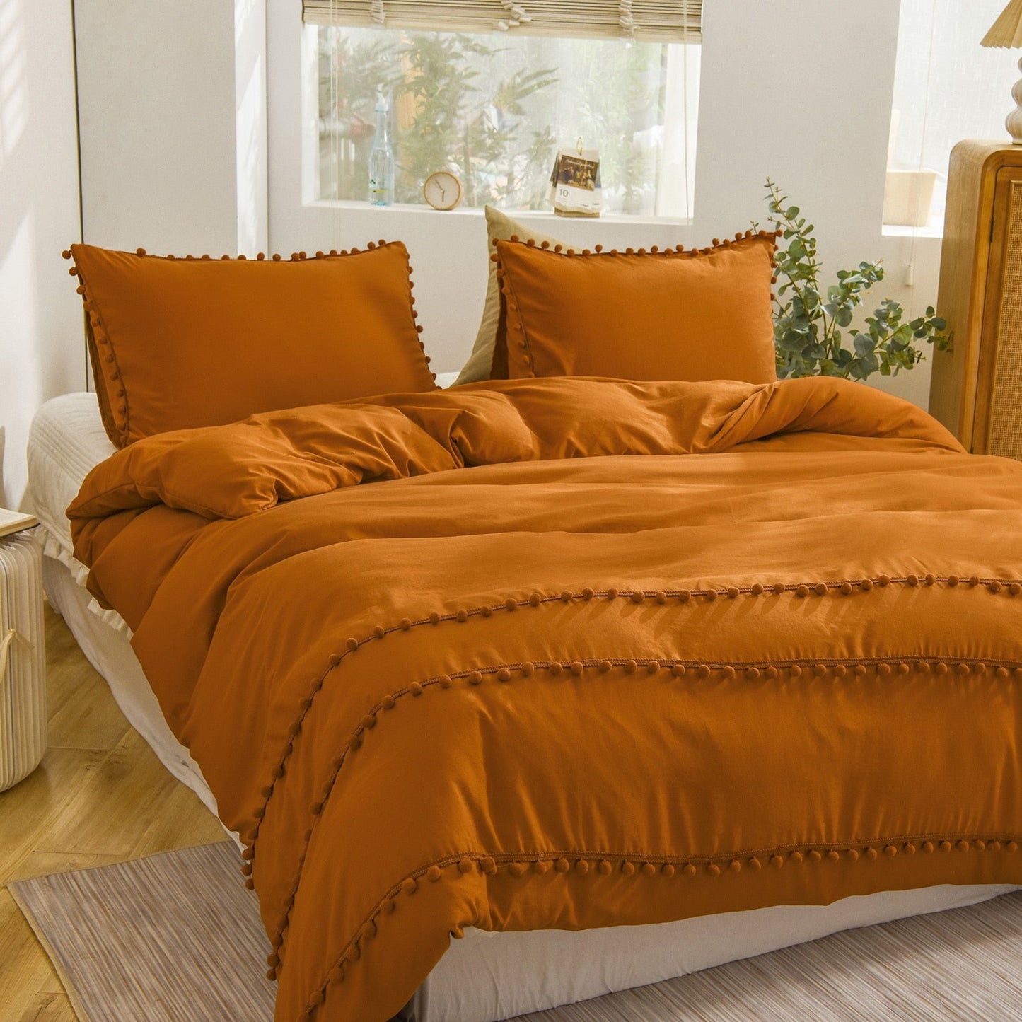 Ensemble de housse de couette à pompons orange brûlé