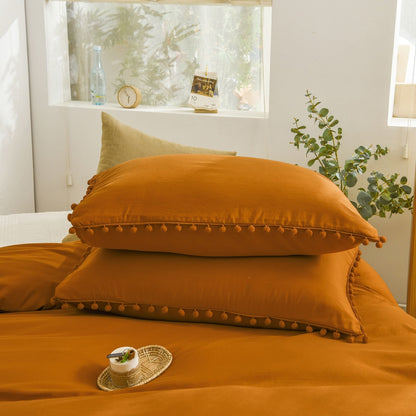 Ensemble de housse de couette à pompons orange brûlé