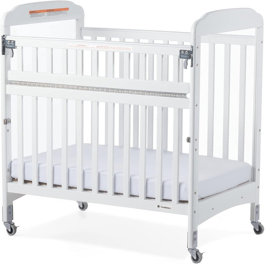 Foundations Serenity Safereach Crib with Adjustable Mattress Board, Compact Wooden Baby Crib with Commercial Grade Casters, Clear End Panels for Child Visibility, Includes 3” Foam Mattress (White) Baby Products Cribs Furniture Infant & Toddler Beds Nursery