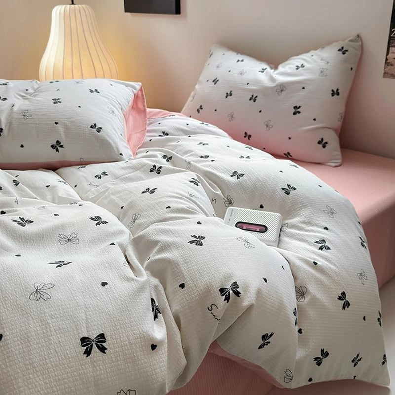 Conjunto de cama rosa claro com arcos femininos