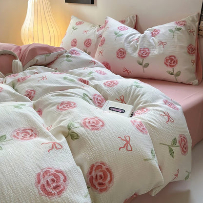 Grazioso set di biancheria da letto con rose rosa e fiocchi