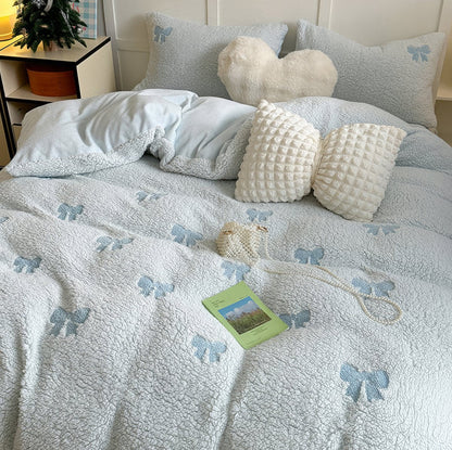 Ensemble de literie en sherpa avec nœuds brodés