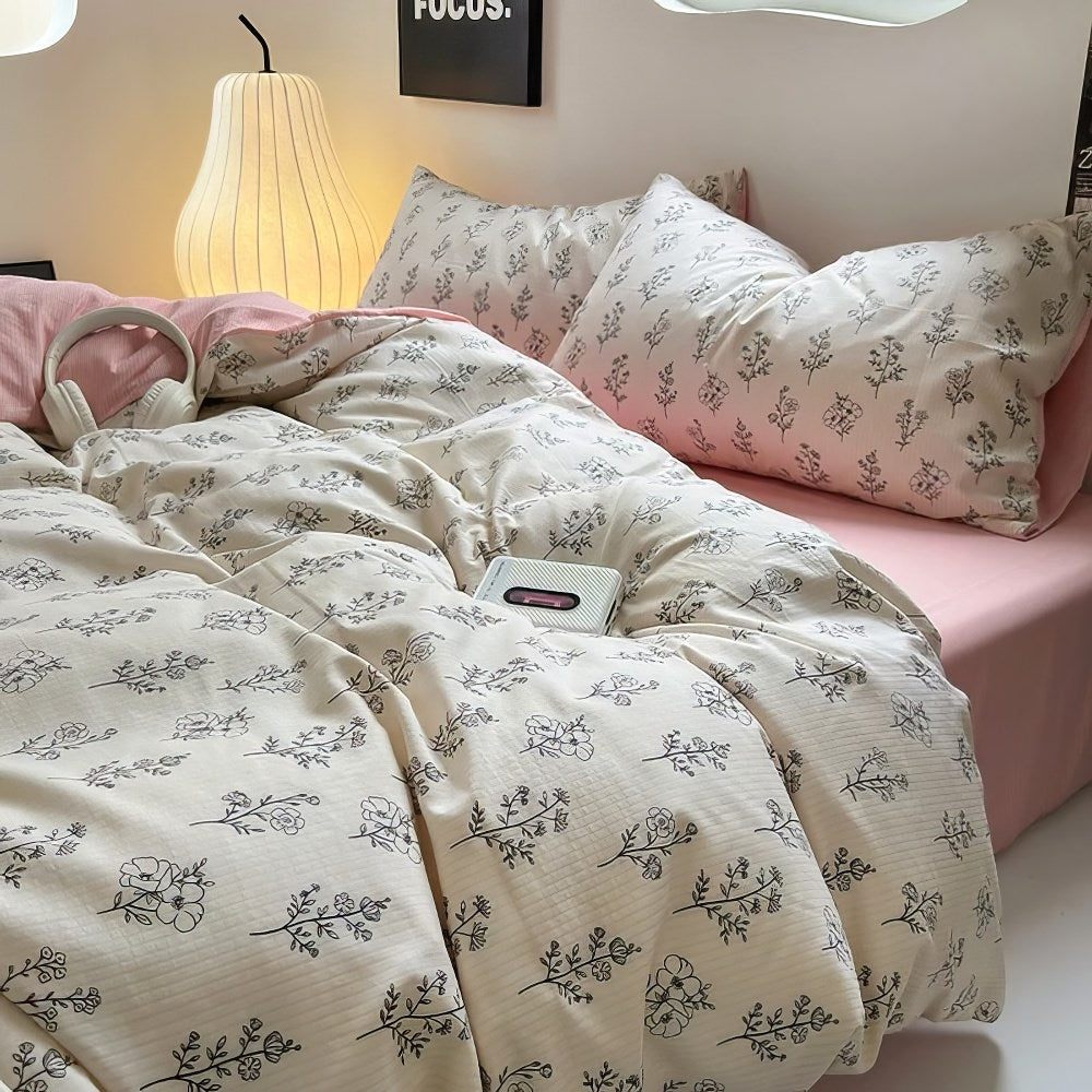 Juego de cama rosa pálido con estampado floral de contorno