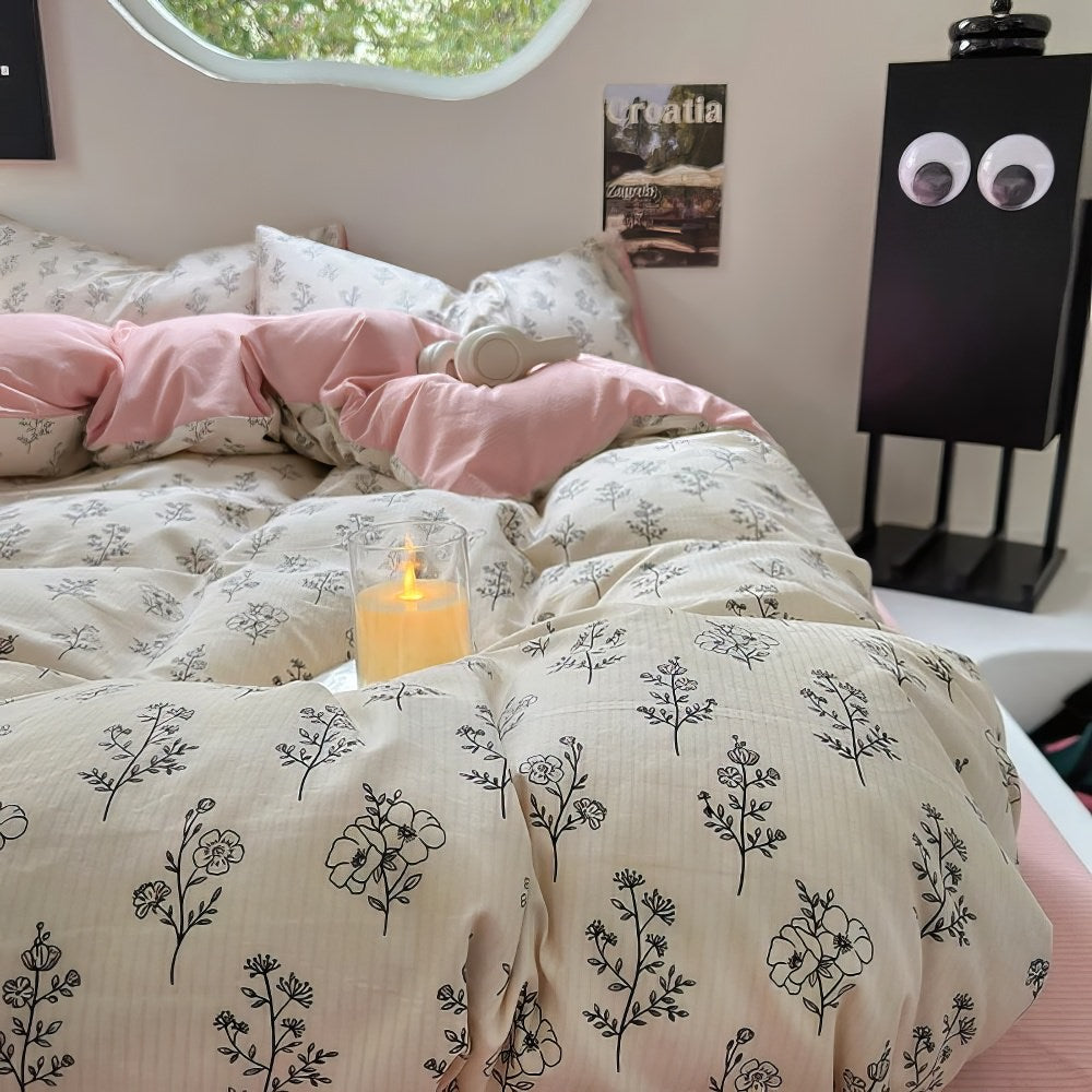 Juego de cama rosa pálido con estampado floral de contorno