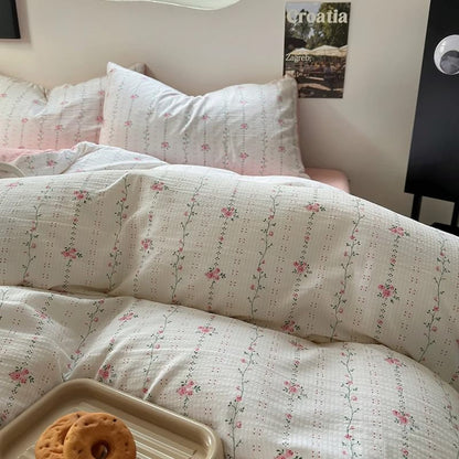 Juego de cama con rayas florales finas en rosa pálido