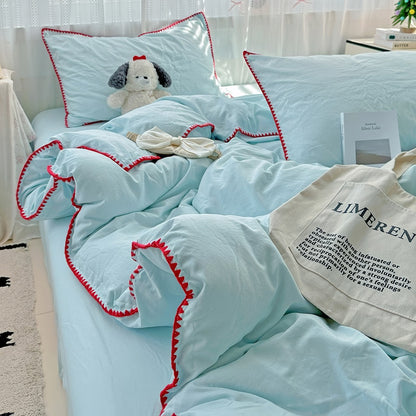 Parure de lit à bords en coquillage et coutures unies