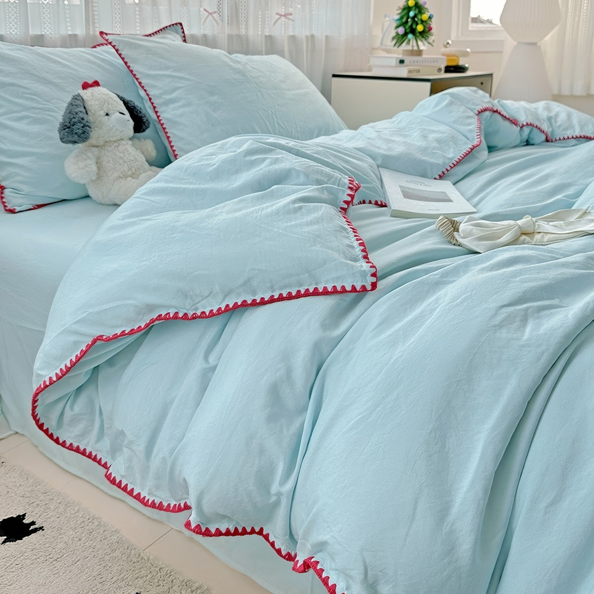 Parure de lit à bords en coquillage et coutures unies