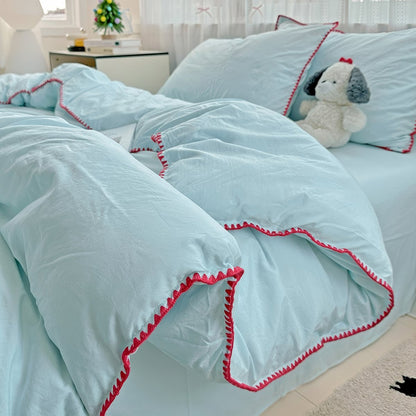 Parure de lit à bords en coquillage et coutures unies